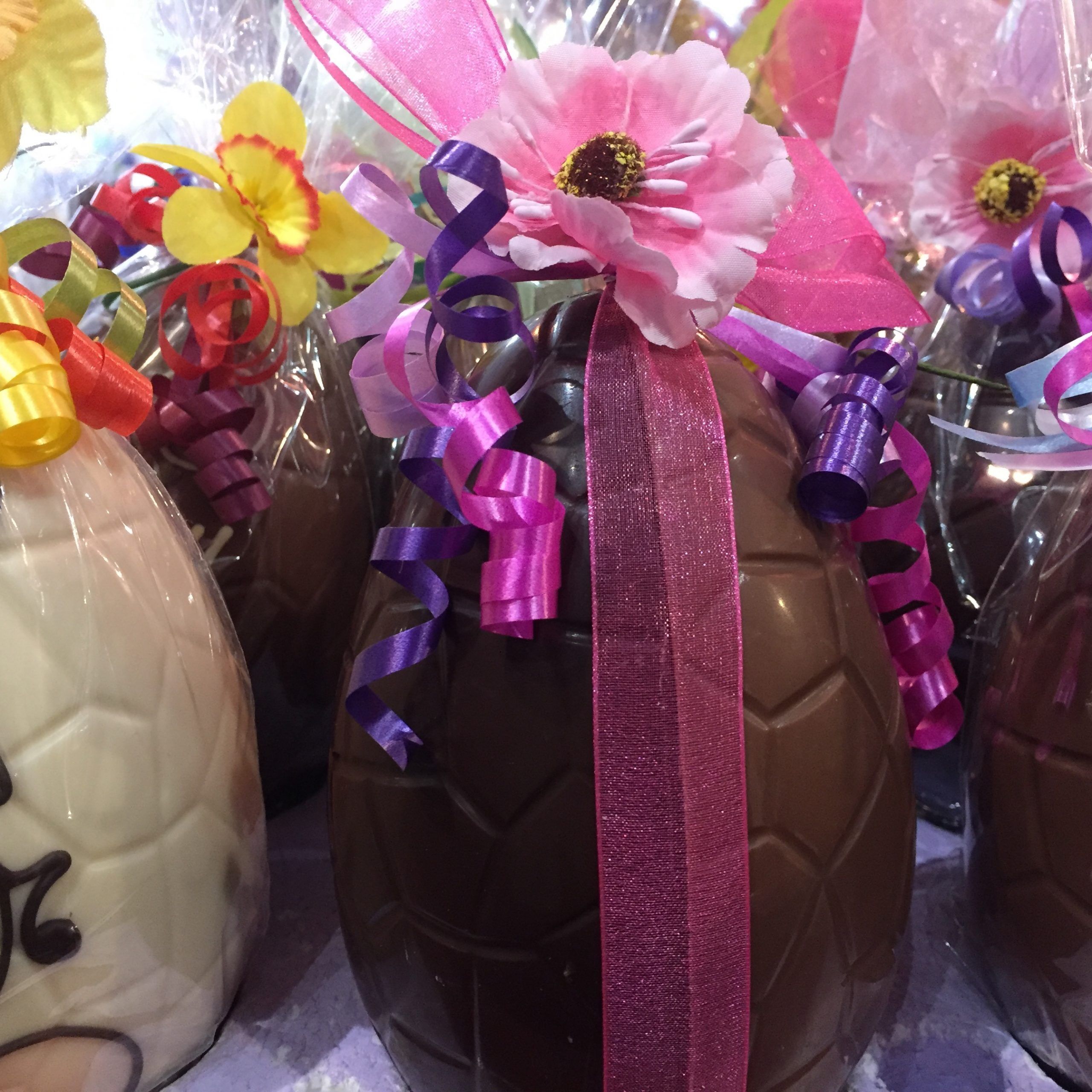 half milk half plain 15cm with pink ribbon and flower