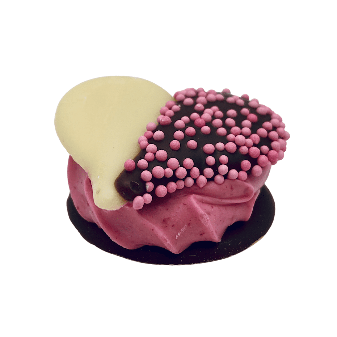 raspberry ganache with a white and milk chocolate heart with pink sprinkles